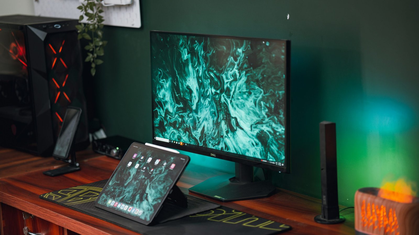 a computer monitor sitting on top of a wooden desk